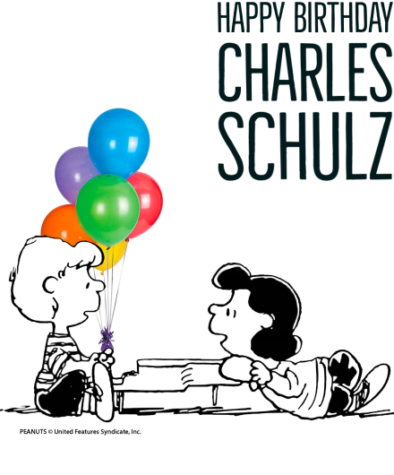 Happy Birthday Charles Schulz. Schroeder sits at the piano with Lucy nearby, balloons behind them.