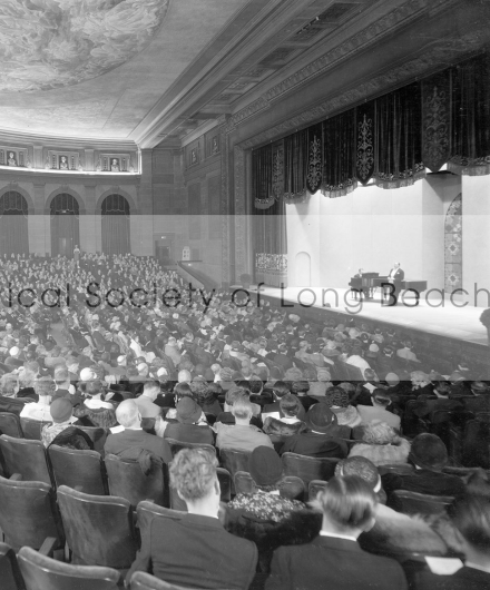 Interior of the Municipal Auditorium in Long Beach from 1932. A grand piano is seen on stage for a formal concert.