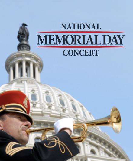 Image of a man in uniform playing the bugle with the Capitol dome behind him.